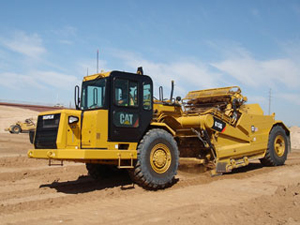 Скрепер с элеваторной загрузкой Caterpillar