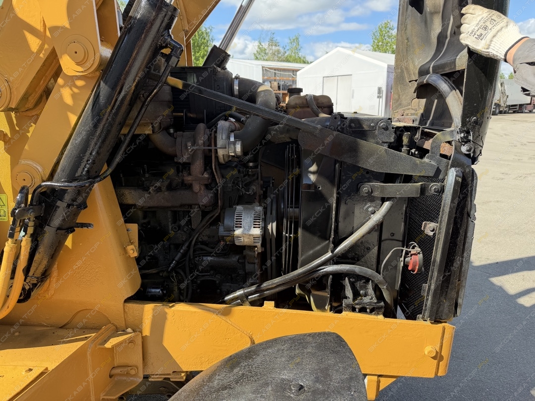 Caterpillar 428E [23]
